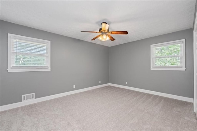 71 Seminole Trl SW, Cartersville, GA 30120 - carpeted empty room with ceiling fan, baseboards, and a textured ceiling