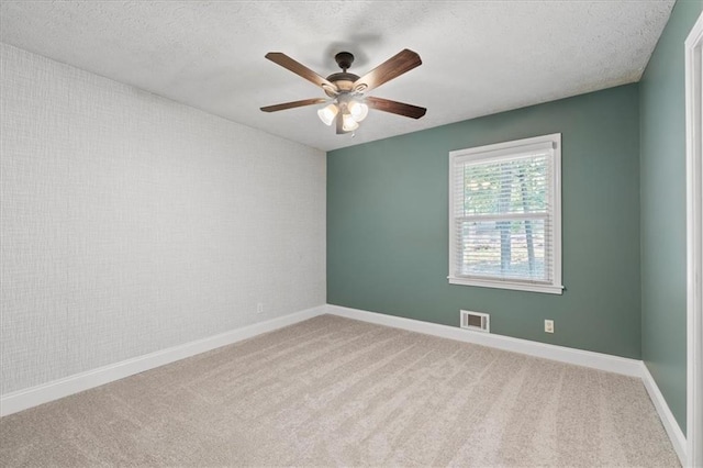 71 Seminole Trl SW, Cartersville, GA 30120 - carpeted spare room with a ceiling fan, baseboards, and a textured ceiling