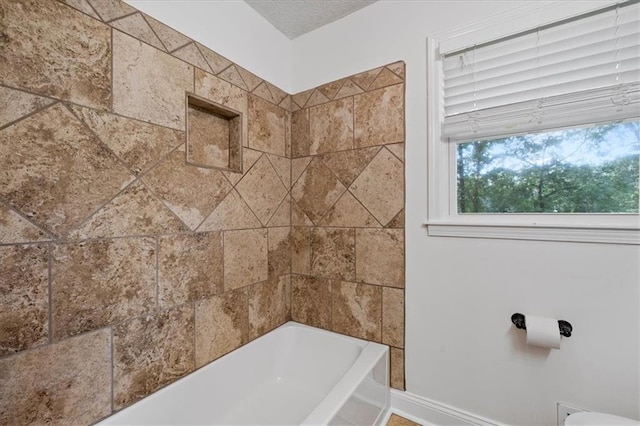 71 Seminole Trl SW, Cartersville, GA 30120 - bathroom featuring baseboards and shower / tub combination
