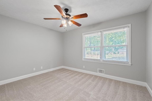 71 Seminole Trl SW, Cartersville, GA 30120 - unfurnished room featuring light colored carpet, baseboards, a ceiling fan, and a textured ceiling