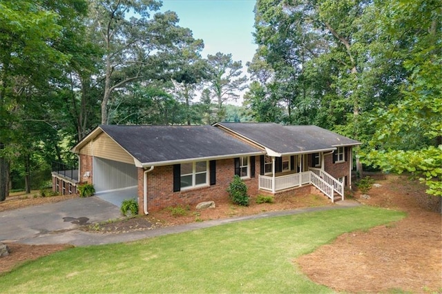 71 Seminole Trl SW, Cartersville, GA 30120 - single story home with covered porch, driveway, brick siding, a front yard, and an attached carport