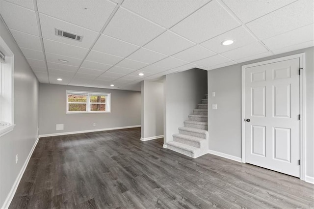 71 Seminole Trl SW, Cartersville, GA 30120 - basement with dark wood finished floors, a drop ceiling, stairway, baseboards, and recessed lighting