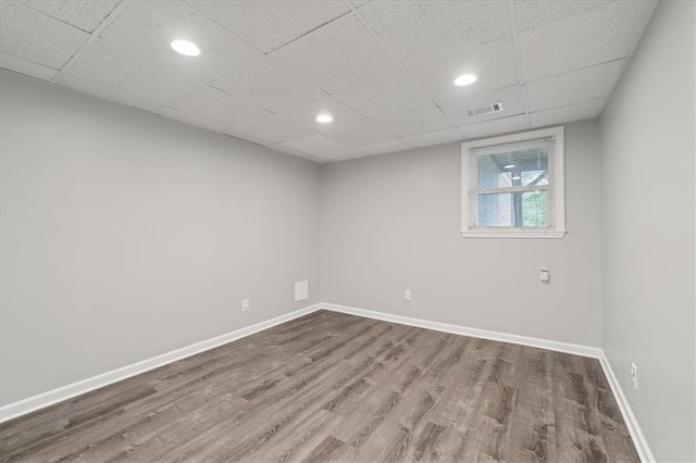 71 Seminole Trl SW, Cartersville, GA 30120 - spare room featuring wood finished floors, baseboards, recessed lighting, and a paneled ceiling