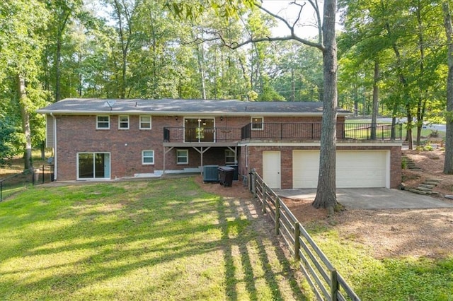 71 Seminole Trl SW, Cartersville, GA 30120 - back of house featuring concrete driveway, central AC unit, brick siding, and a deck