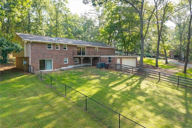 71 Seminole Trl SW, Cartersville, GA 30120 - rear view of property featuring brick siding, a garage, a deck, and central AC unit