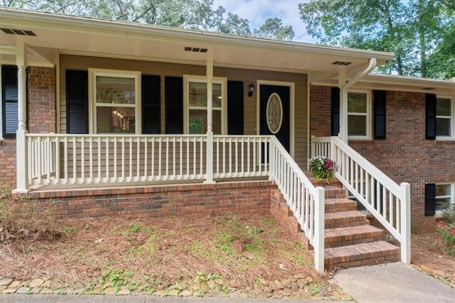 71 Seminole Trl SW, Cartersville, GA 30120 - view of front of house featuring covered porch and brick siding