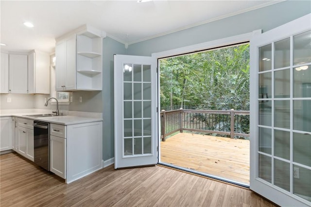 178 Seals Dr, Dallas, GA 30157 - doorway to outside featuring baseboards, a sink, crown molding, and wood finished floors
