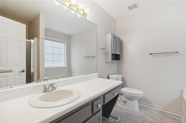 178 Seals Dr, Dallas, GA 30157 - full bathroom with a shower with door, vanity, baseboards, toilet, and visible vents