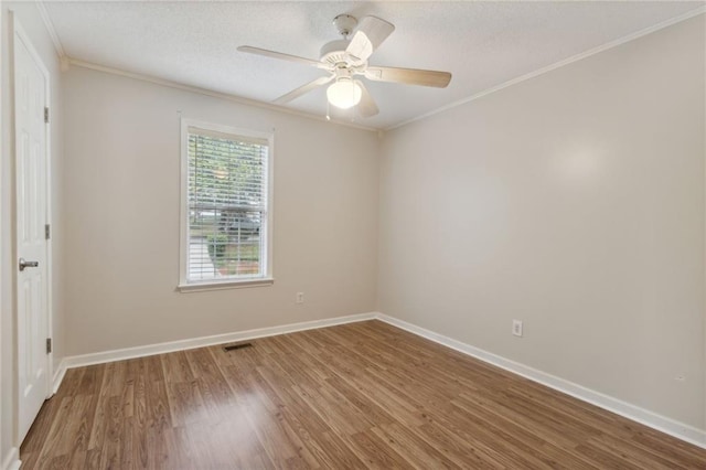 178 Seals Dr, Dallas, GA 30157 - empty room with a textured ceiling, wood finished floors, baseboards, and ornamental molding