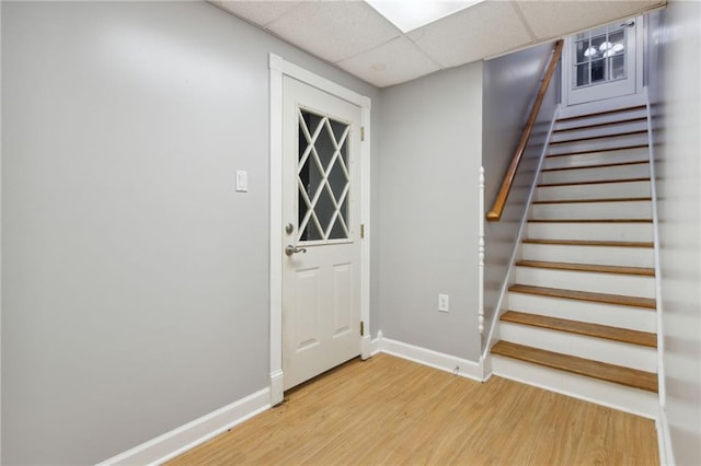 interior space featuring hardwood / wood-style flooring and a paneled ceiling