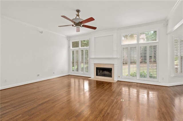 5725 Lake Oak Lndg, Cumming, GA 30040 - unfurnished living room with crown molding, healthy amount of natural light, a tile fireplace, ceiling fan, and baseboards