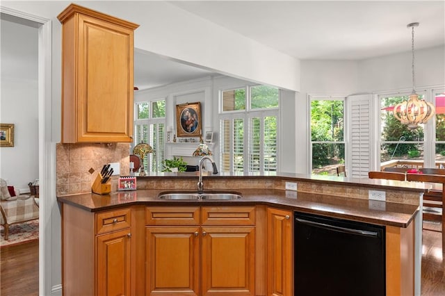 5725 Lake Oak Lndg, Cumming, GA 30040 - kitchen featuring dishwasher, a sink, wood finished floors, and tasteful backsplash