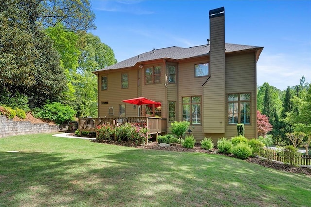 5725 Lake Oak Lndg, Cumming, GA 30040 - back of house featuring a yard, a chimney, and a deck