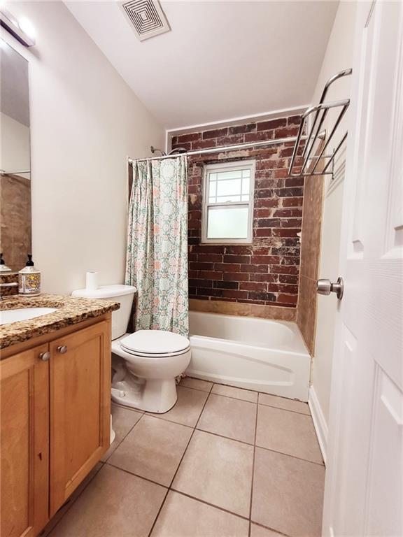 40 Daniel St SE Unit 7, Atlanta, GA 30312 - bathroom with tile patterned floors, toilet, visible vents, shower / tub combo, and vanity