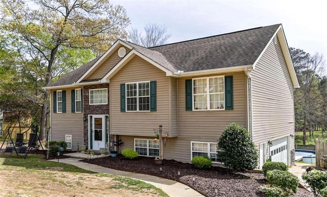 bi-level home featuring a garage