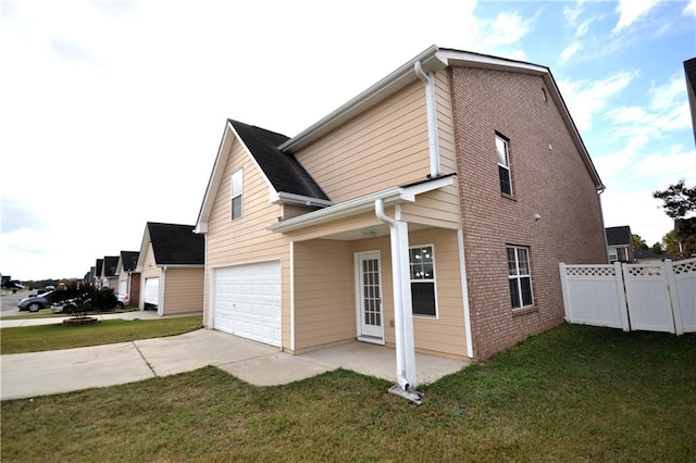 view of side of property with a lawn