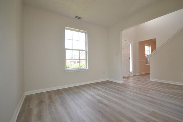 spare room with light wood-type flooring