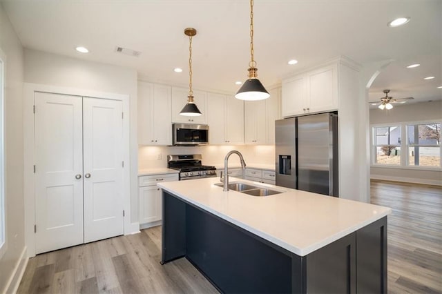 kitchen featuring white cabinetry, sink, and stainless steel appliances