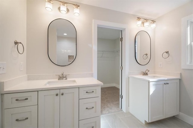 bathroom featuring tile patterned flooring and vanity