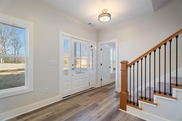 entryway with wood-type flooring