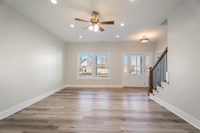 entrance foyer featuring ceiling fan and wood-type flooring