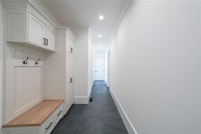mudroom with baseboards, recessed lighting, and ornamental molding