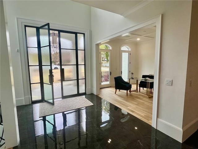 doorway to outside with baseboards, french doors, and ornamental molding