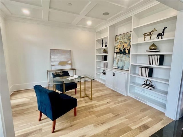 sitting room featuring light wood finished floors, baseboards, crown molding, built in shelves, and coffered ceiling