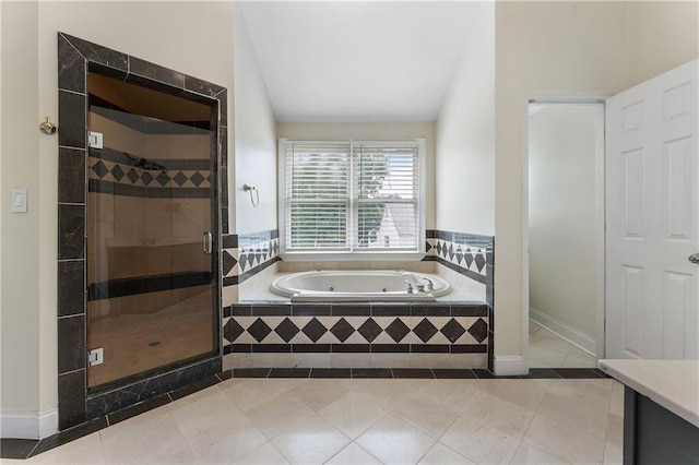 1491 Black Hickory Pl, Norcross, GA 30093 - full bath featuring a whirlpool tub, a stall shower, tile patterned floors, vaulted ceiling, and vanity