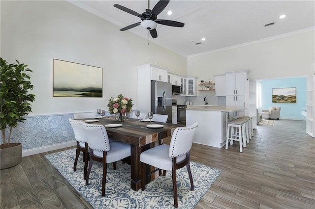 1491 Black Hickory Pl, Norcross, GA 30093 - dining space with crown molding, a ceiling fan, light wood-style flooring, baseboards, and recessed lighting