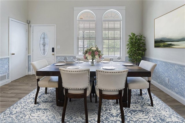 1491 Black Hickory Pl, Norcross, GA 30093 - dining room featuring wood finished floors, wallpapered walls, and a wainscoted wall