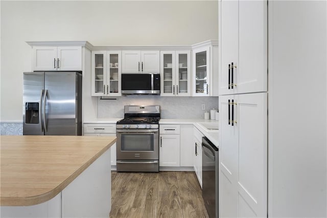1491 Black Hickory Pl, Norcross, GA 30093 - kitchen with appliances with stainless steel finishes, light countertops, and white cabinets