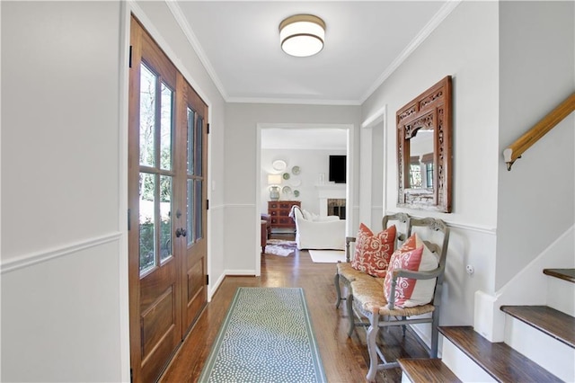 435 Grenock Cir, Atlanta, GA 30328 - foyer with crown molding, wood finished floors, and a fireplace
