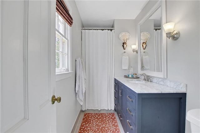 435 Grenock Cir, Atlanta, GA 30328 - bathroom with vanity, baseboards, toilet, and wood finished floors