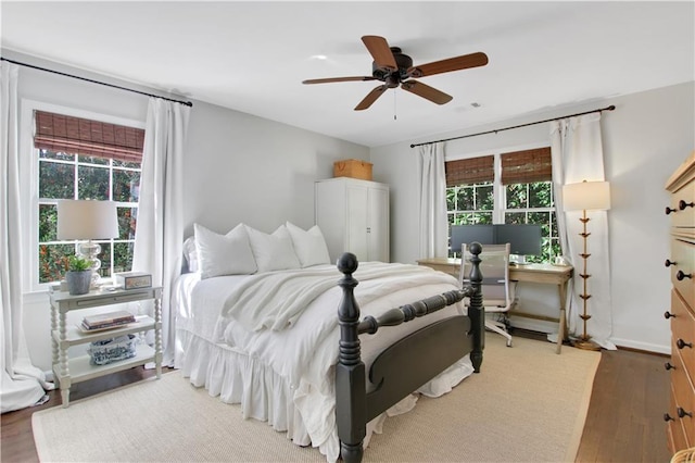 435 Grenock Cir, Atlanta, GA 30328 - bedroom with multiple windows, wood finished floors, and a ceiling fan