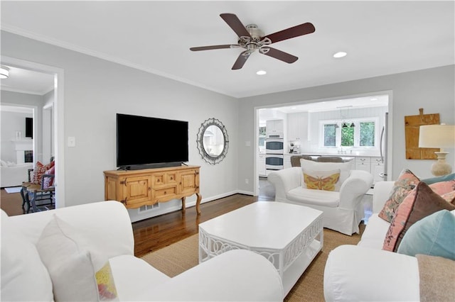 435 Grenock Cir, Atlanta, GA 30328 - living room with recessed lighting, wood finished floors, a ceiling fan, crown molding, and baseboards