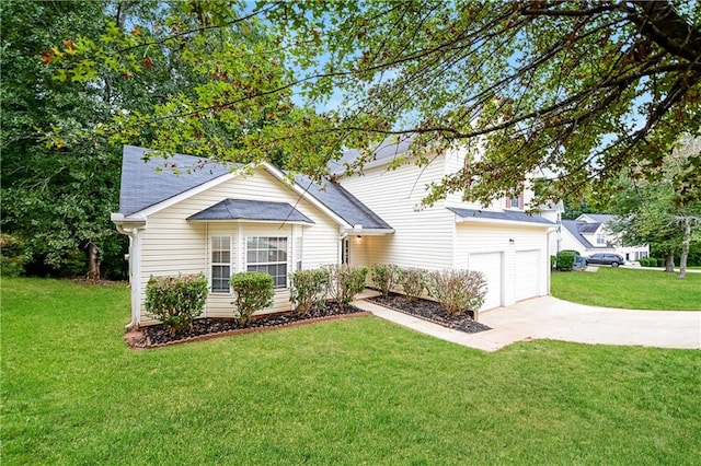 ranch-style home featuring a garage and a front lawn