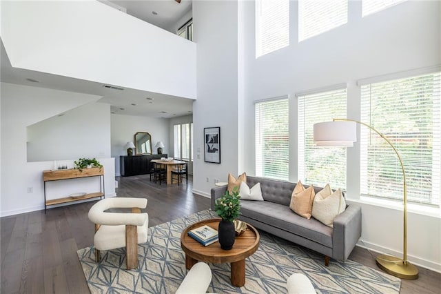 399 Pratt Dr SE, Atlanta, GA 30315 - living area with baseboards, wood finished floors, and a towering ceiling