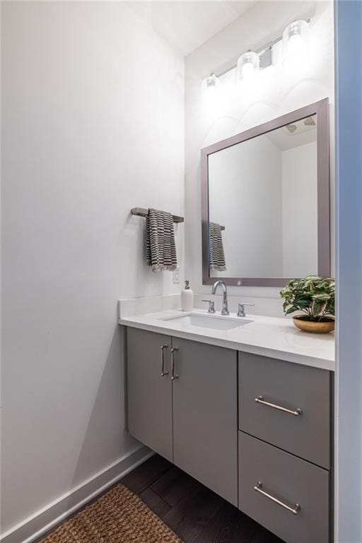 399 Pratt Dr SE, Atlanta, GA 30315 - bathroom featuring vanity, wood finished floors, and baseboards