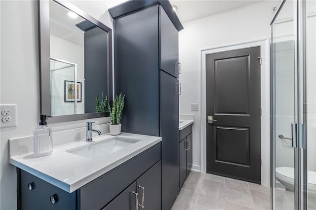 399 Pratt Dr SE, Atlanta, GA 30315 - full bath featuring vanity, toilet, tile patterned floors, and a shower with shower door
