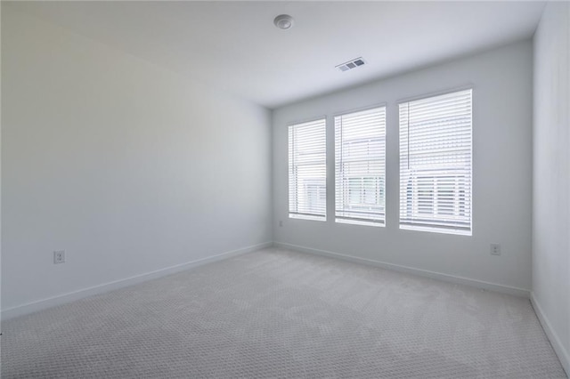 399 Pratt Dr SE, Atlanta, GA 30315 - spare room with light carpet and baseboards