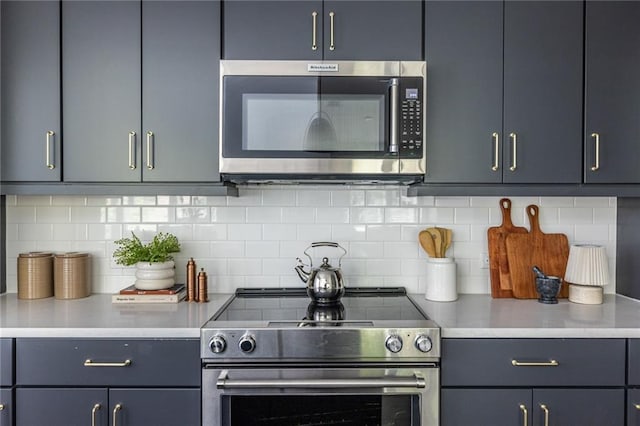 399 Pratt Dr SE, Atlanta, GA 30315 - kitchen with stainless steel appliances, light countertops, and tasteful backsplash