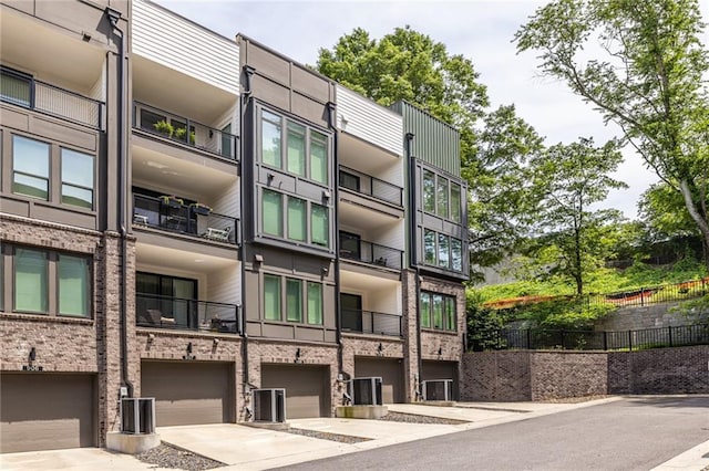 399 Pratt Dr SE, Atlanta, GA 30315 - view of apartment building / complex featuring a garage and driveway