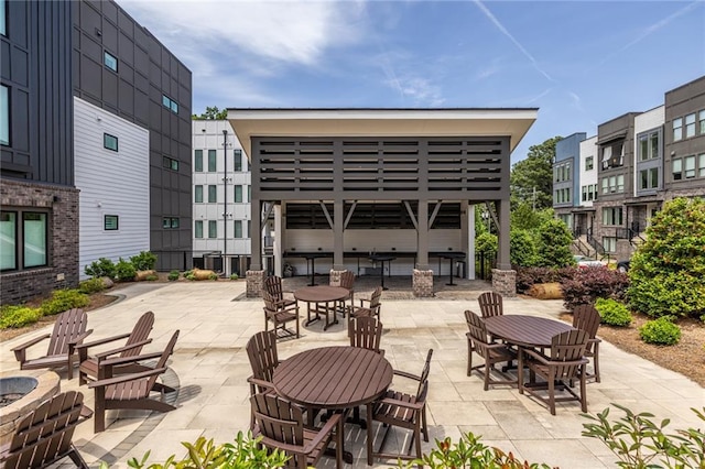 399 Pratt Dr SE, Atlanta, GA 30315 - view of patio / terrace with outdoor dining area and a fire pit