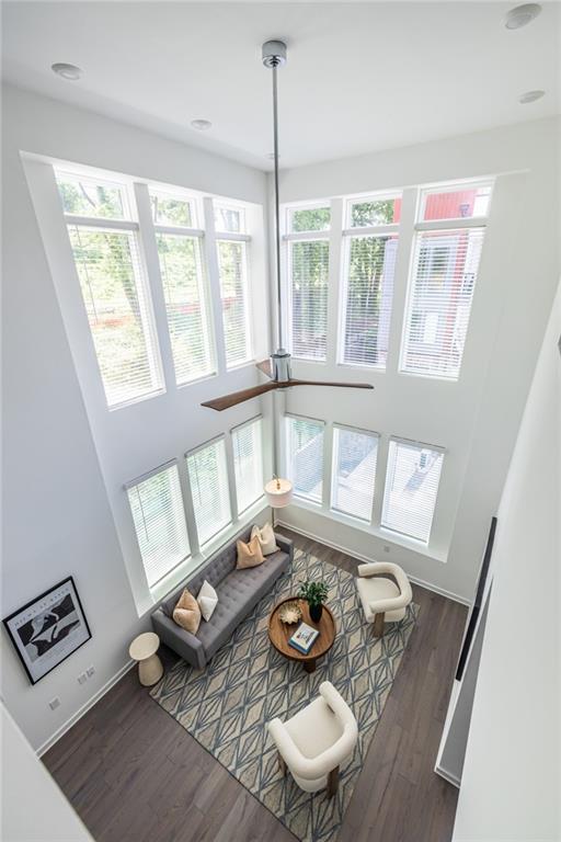 399 Pratt Dr SE, Atlanta, GA 30315 - living area with wood finished floors, healthy amount of natural light, and baseboards