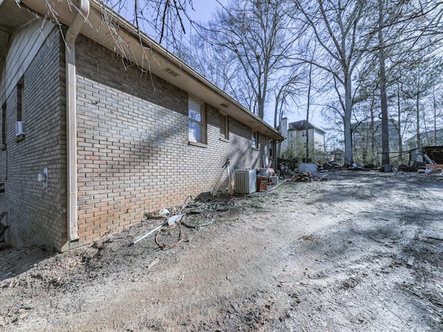 view of side of home with cooling unit