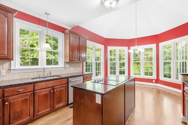 kitchen featuring sink, light wood-type flooring, decorative backsplash, stainless steel dishwasher, and a kitchen island