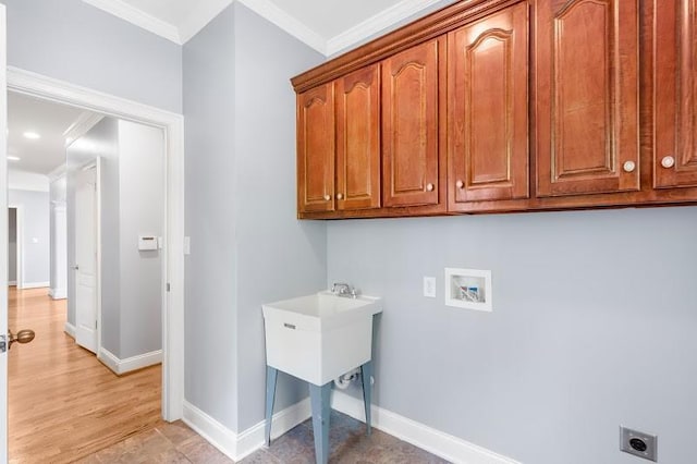 laundry area featuring washer hookup, crown molding, cabinet space, electric dryer hookup, and baseboards