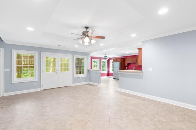 unfurnished living room featuring recessed lighting, french doors, ceiling fan, and baseboards