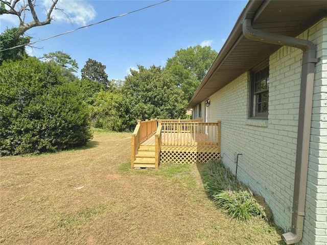 view of yard with a wooden deck